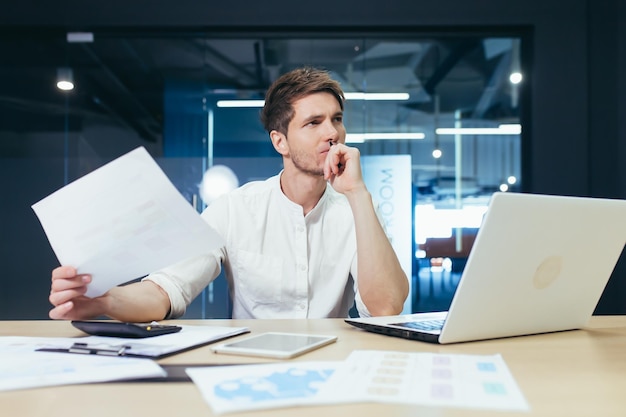 Thinking business man working in the office