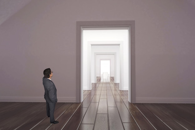 Thinking businessman touching his glasses against white corridor with open doors