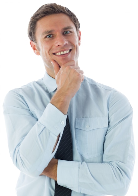 Thinking businessman with hand on chin