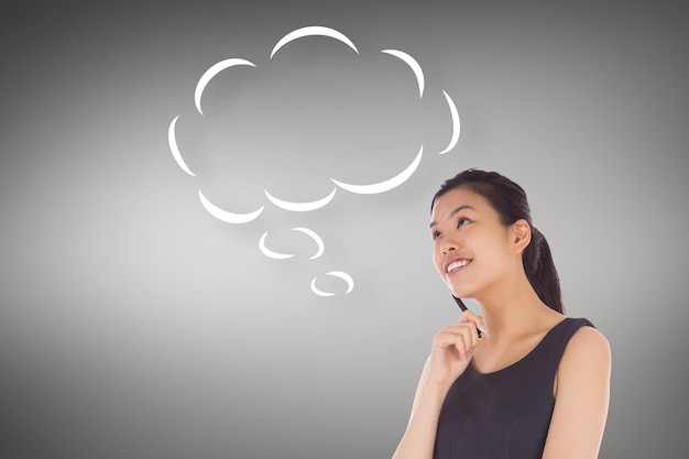 Thinking businesswoman with speech bubble against grey vignette