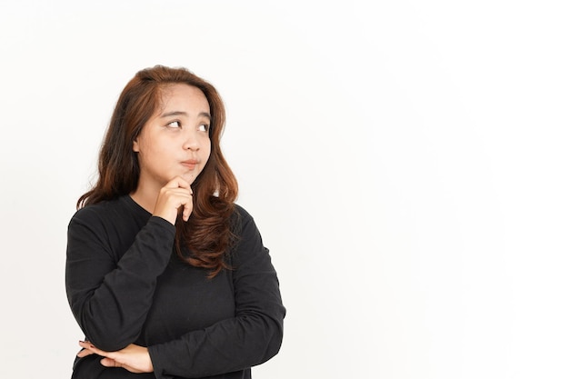 Photo thinking gesture of beautiful asian woman wearing black shirt isolated on white background