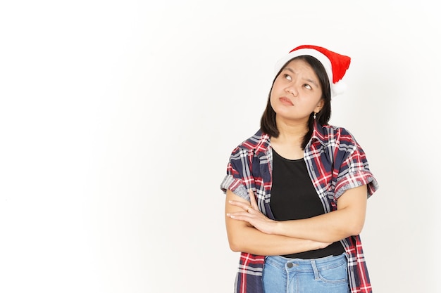 Thinking Gesture of Beautiful Asian Woman Wearing Red Plaid Shirt and Santa Hat Isolated On White