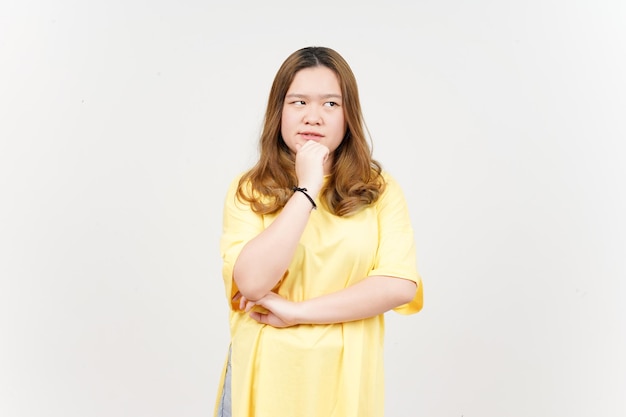 Thinking gesture of Beautiful Asian Woman wearing yellow TShirt Isolated On White Background