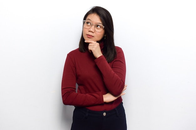 Thinking gesture concept of Young beautiful asian women dress red shirt isolated on white background