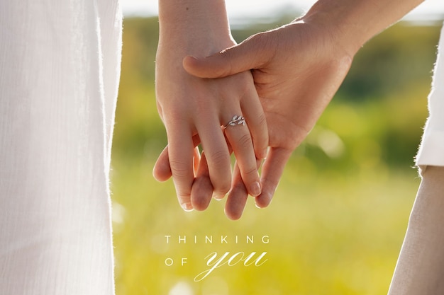 Photo thinking of you text over image of peopel holding hands