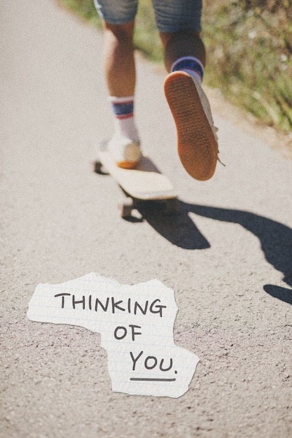 Thinking of you text over image of skateboarder