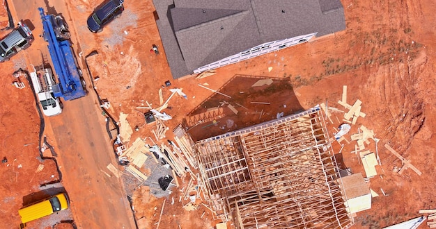 This is an aerial view of an incomplete subdivision housing construction site that is still in the process of being completed