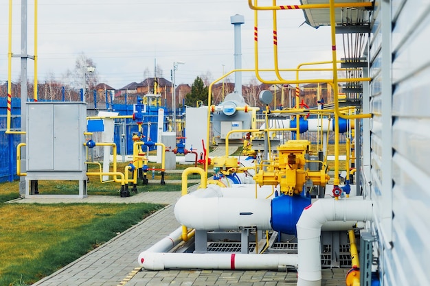 This is new gas compressor station on summer day View of production facility from outside Pipes and equipment for gasification Background