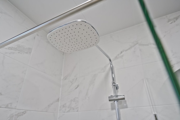 Photo this shower head lets the water drip from above your head