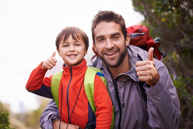 This trail is great for all levels Portrait of a father and son enjoying a hike together