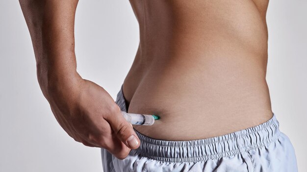 This will give me the boost I need Cropped shot of a man injecting himself on his buttock
