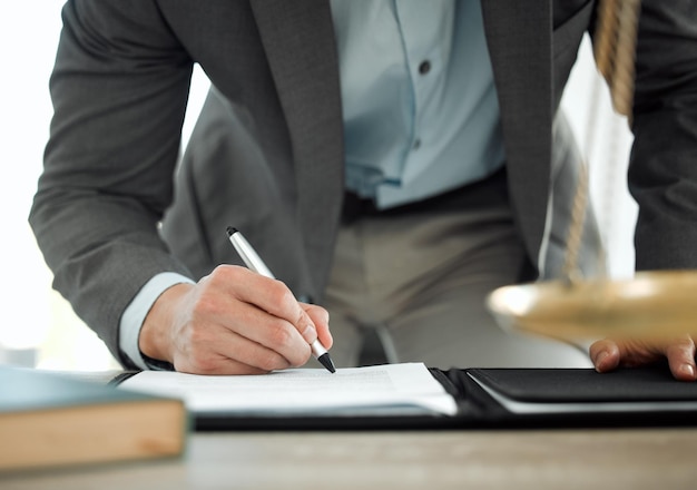 This will set me up for life Shot of a lawyer signing a contract in his office