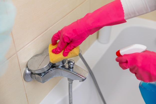 Thoroughly cleaning bathroom fixtures with a sponge and sprays is essential for hygiene