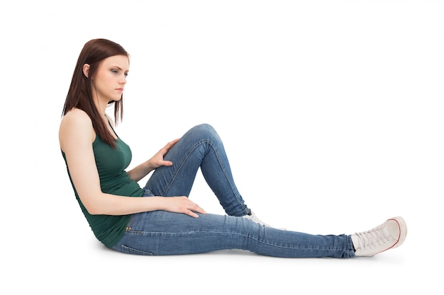 Thoughtful attractive brunette sitting