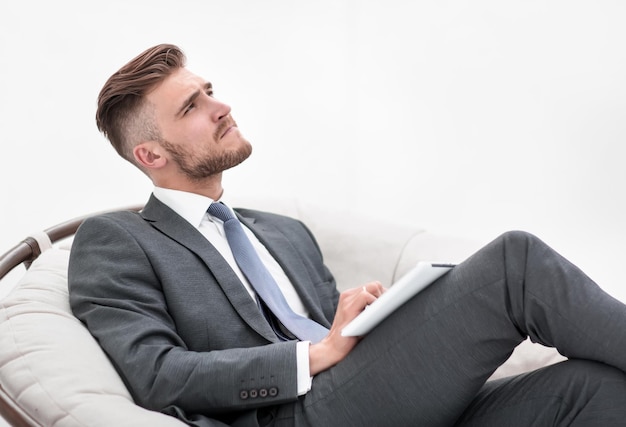 Thoughtful business man with digital tablet