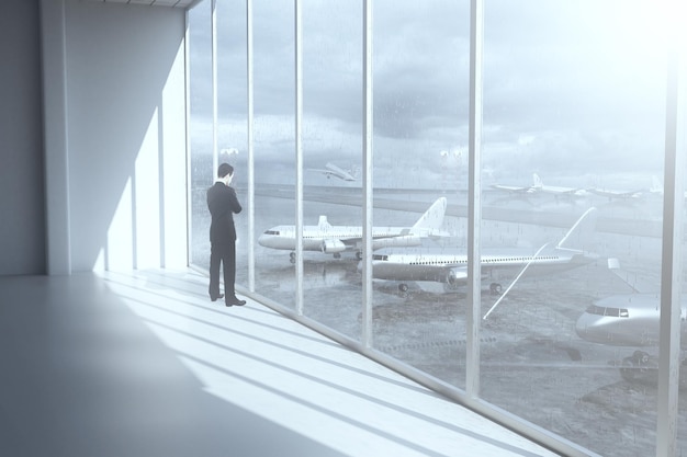 Thoughtful businessman in airport terminal