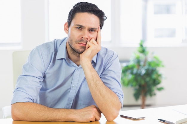 Thoughtful businessman at desk