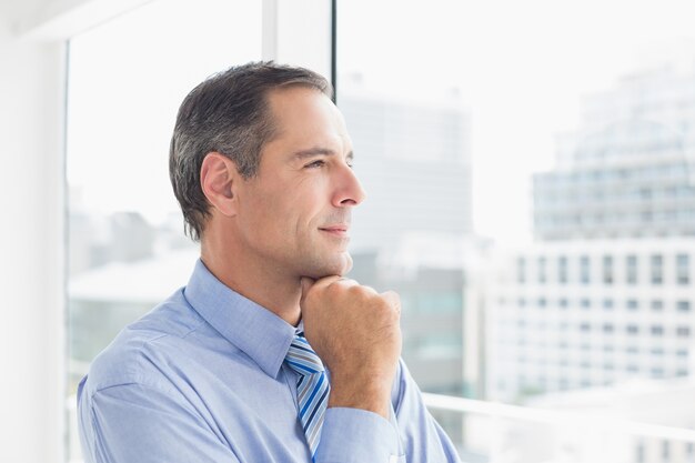 Thoughtful businessman looking away