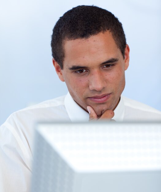 Thoughtful businessman working with a computer