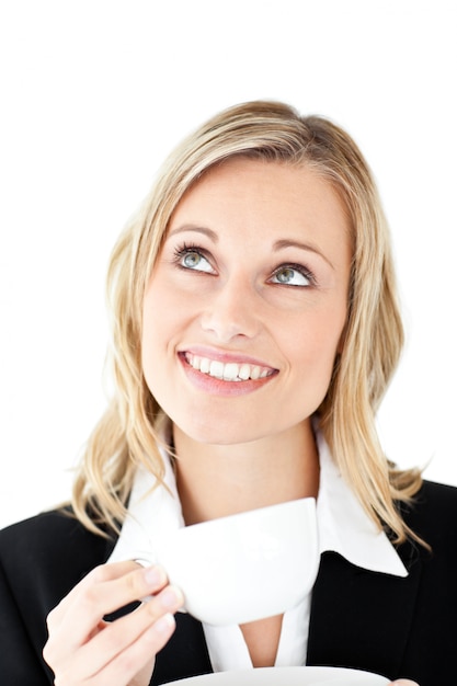 Thoughtful businesswoman holding a cup of coffee