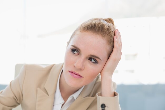 Thoughtful businesswoman looking away