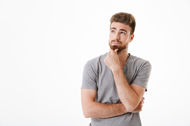 Thoughtful concentrated young man