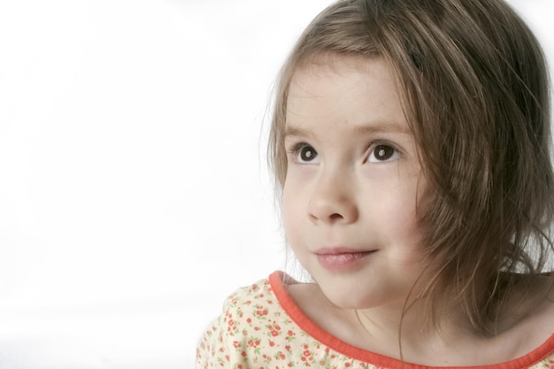 Thoughtful girl on a white background