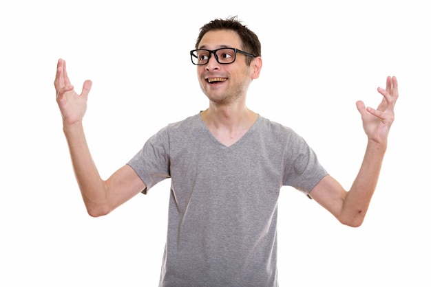 thoughtful happy young man smiling and wearing eyeglasses