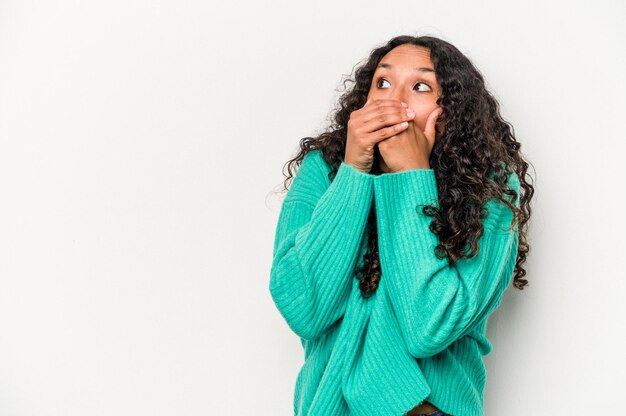 Thoughtful looking to a copy space covering mouth with hand