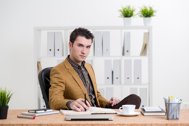 Thoughtful man at office desk