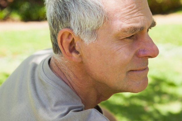 Thoughtful mature man at park