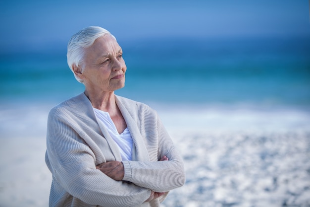 Thoughtful mature woman day dreaming