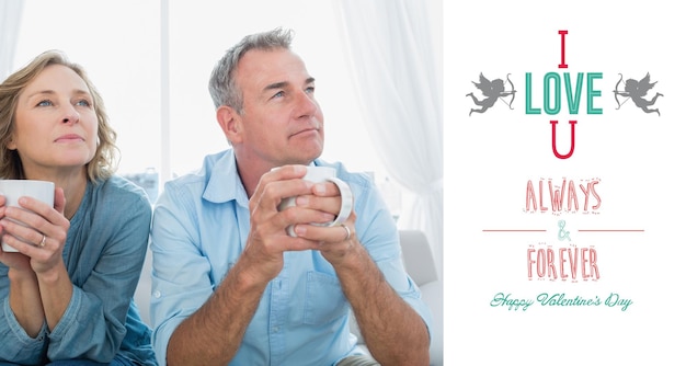 Photo thoughtful middle aged couple sitting on the couch having coffee against cute valentines message