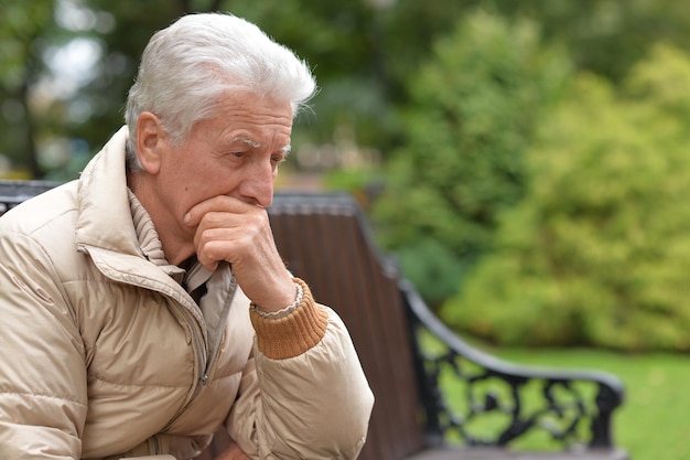 Thoughtful senior man in park