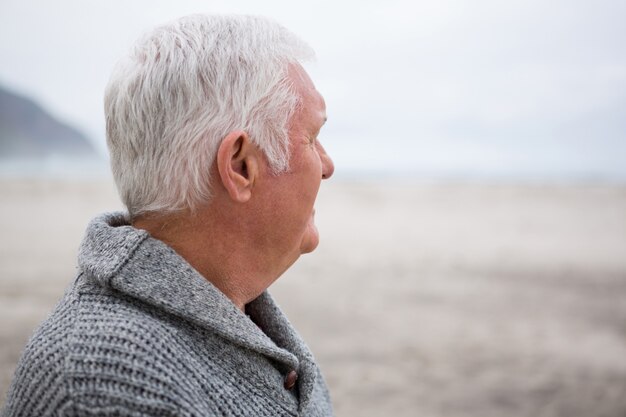 Thoughtful senior man standing