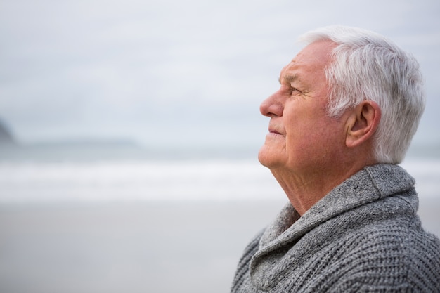 Thoughtful senior man standing