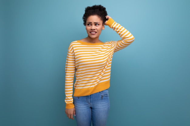 Thoughtful smart latin young woman with afro hair