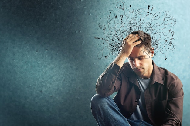 Thoughtful stressed young man with a mess