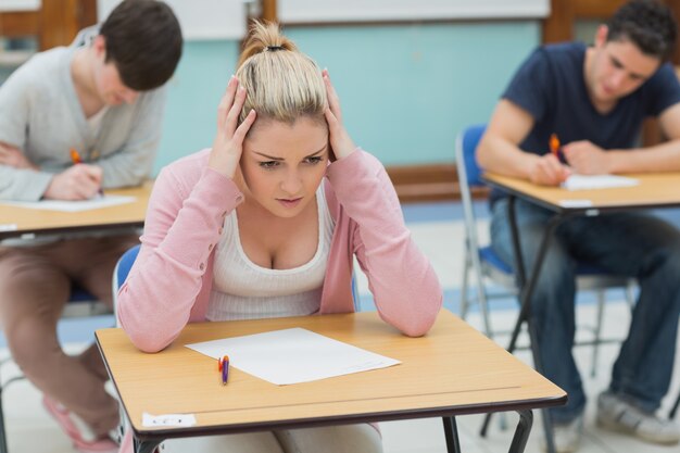 Thoughtful student sitting in classroom