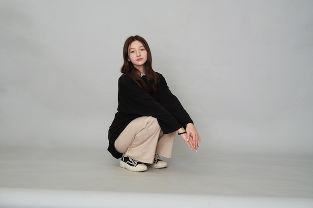 Thoughtful teen girl sits contemplatively her somber expression reflecting the complexities of