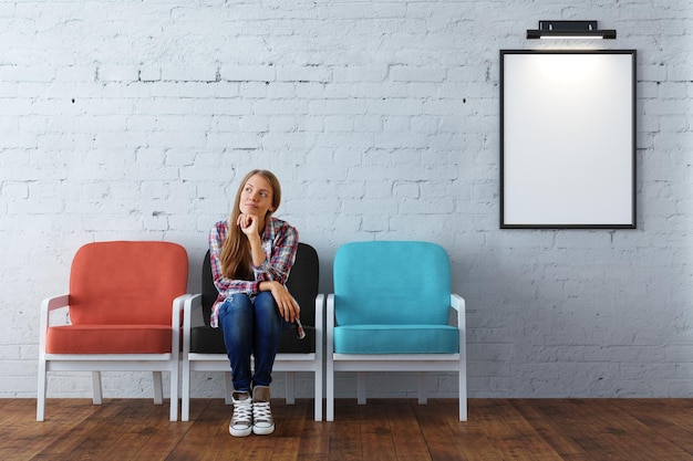 Thoughtful woman in room with frame