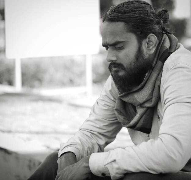 Thoughtful young man sitting