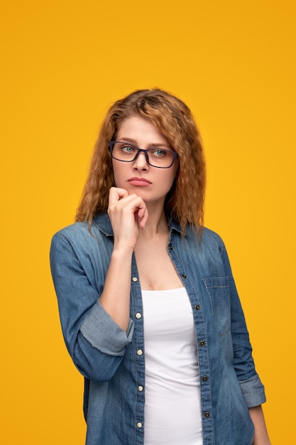 Thoughtful young woman looking away