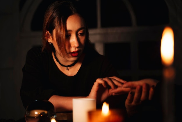 thoughtful young woman sitting in the dark