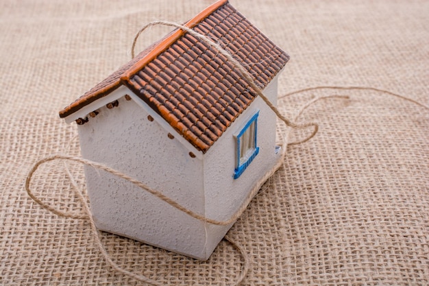 Thread wrapped around a model house