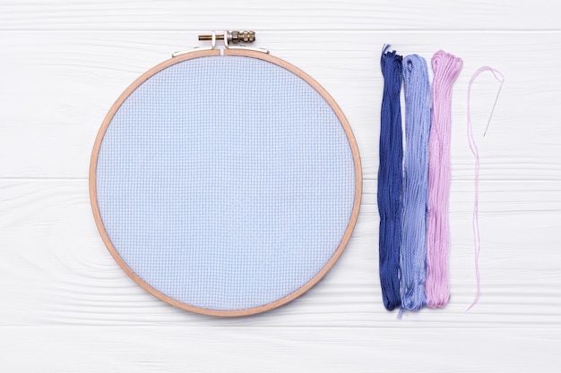 Premium Photo  Wooden hoop for cross stitch. a tambour frame for  embroidery and canvas with free space for your design on a white  background. 3d rendering