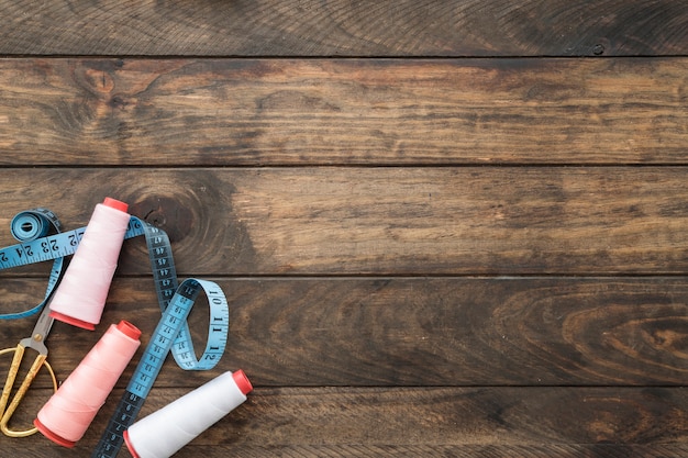 Photo threads near scissors and tape measure