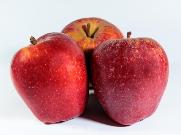 Three apples on white background