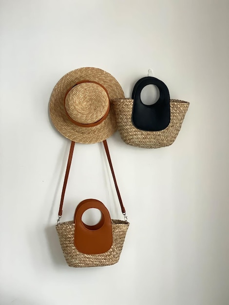 Three bags hanging on a wall with one that says'bag '