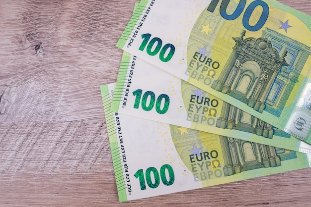 Three banknotes of 100 euros on the table